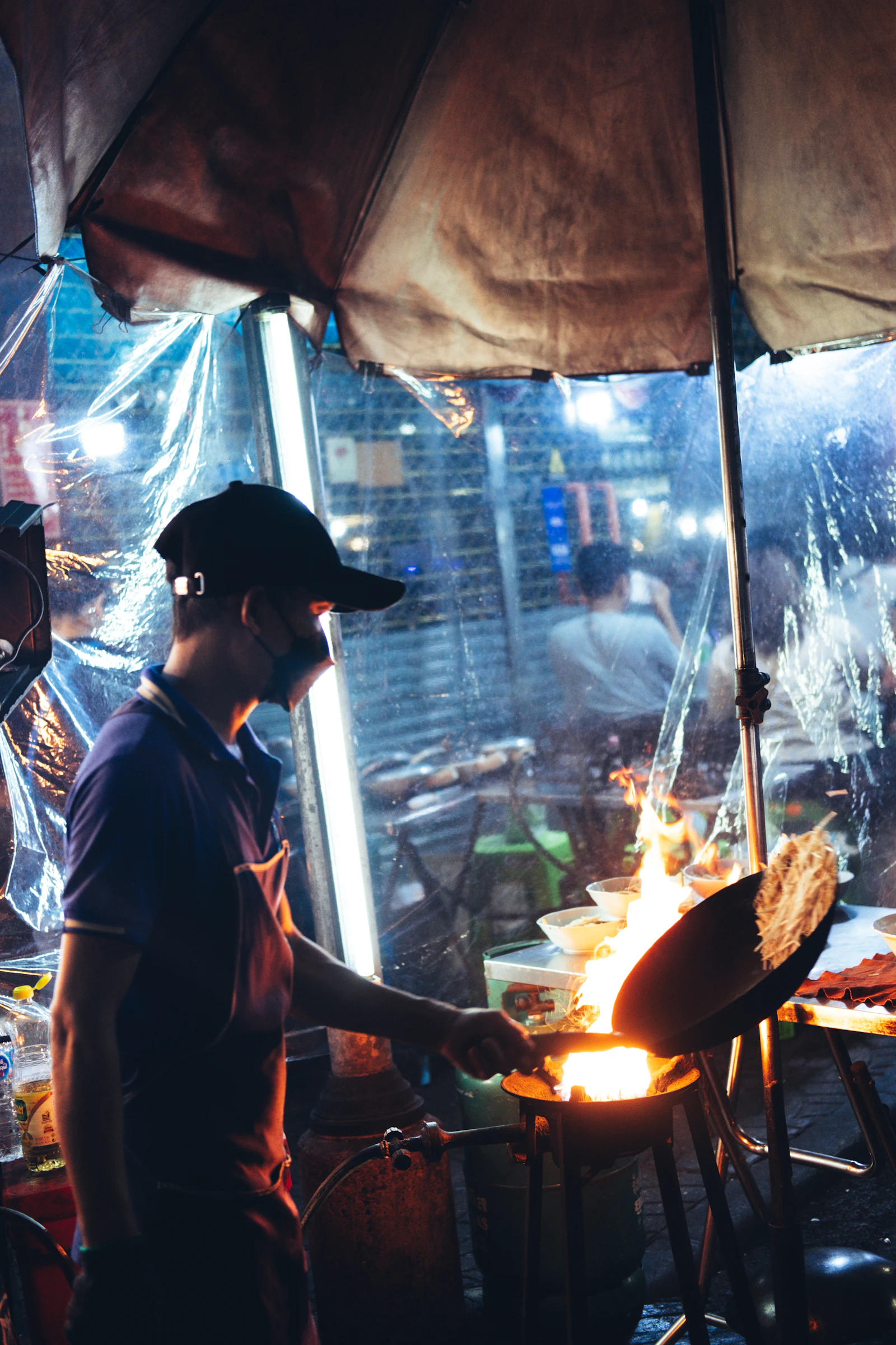 Guest actively cooking Balinese food at a hands-on lesson in Ubud