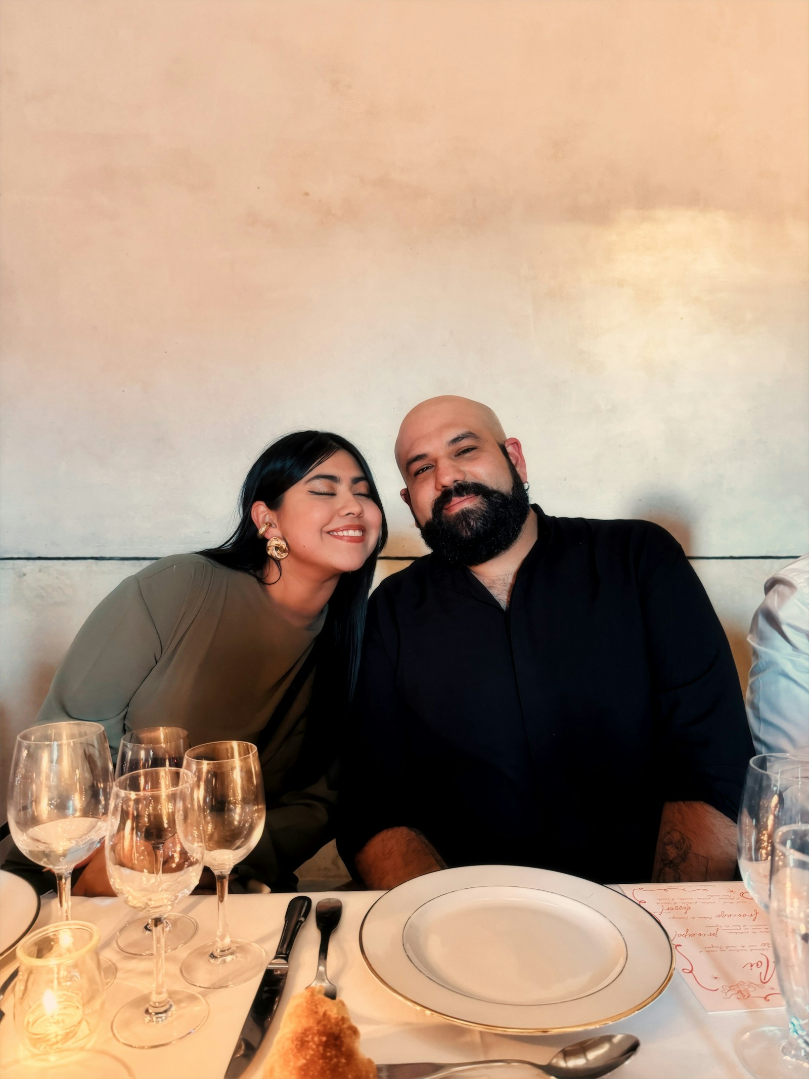 Couple sharing an elegant restaurant meal in Ubud