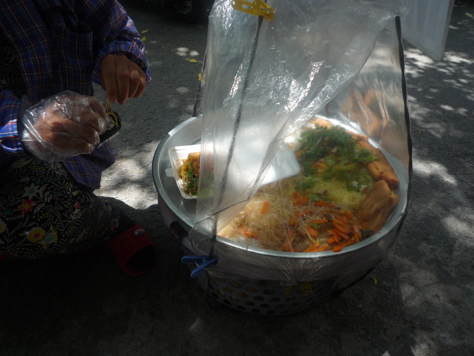 Traveler asking a Balinese cooking host a question during a private cooking lesson near Ubud