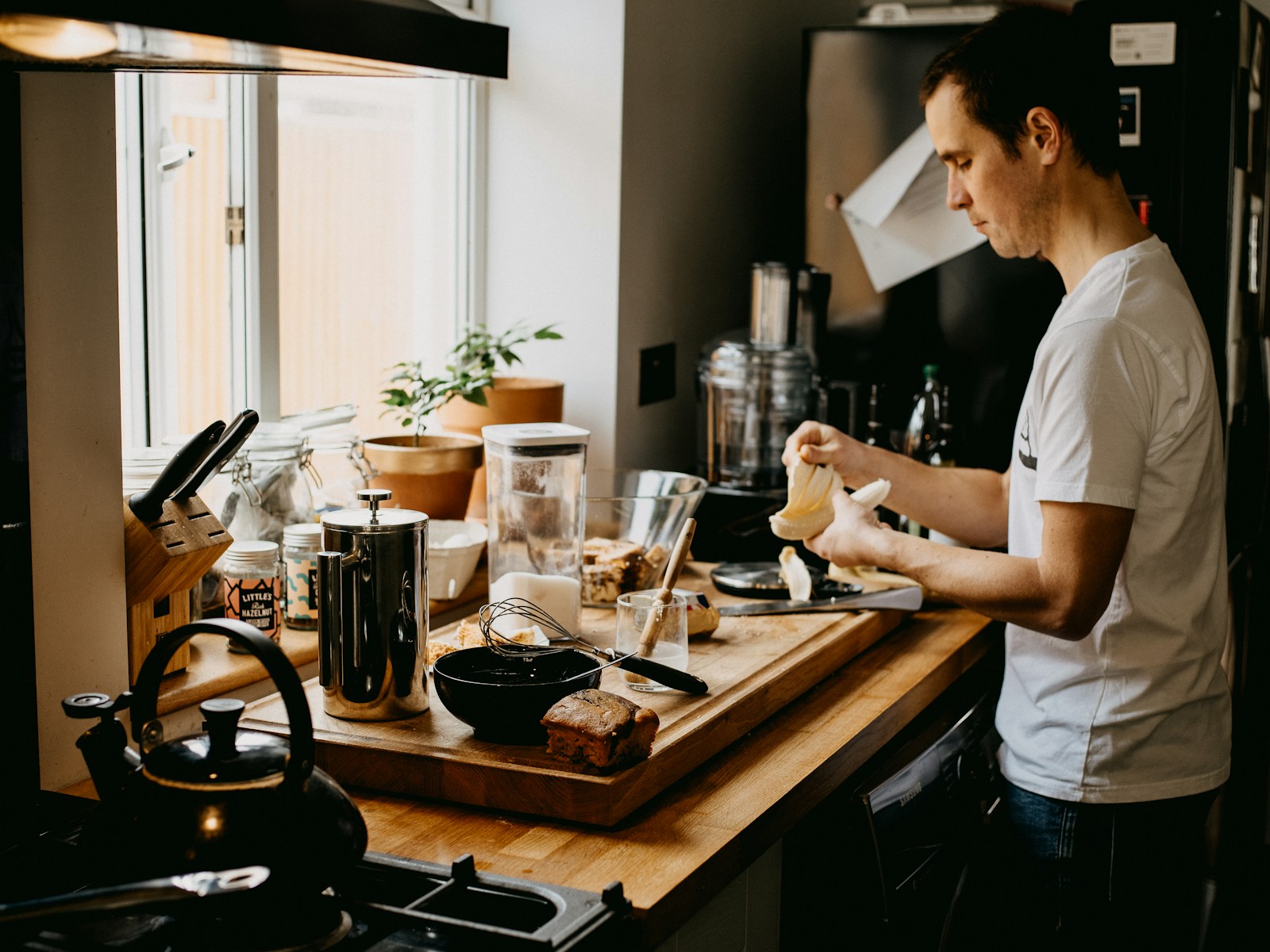 Person preparing food alone in a home kitchen